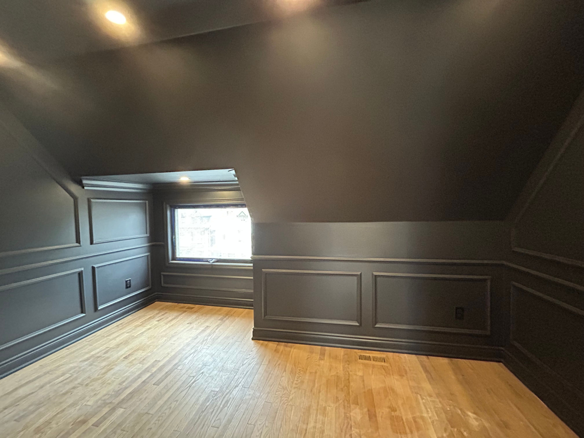 Dark panelled attic study — completed project